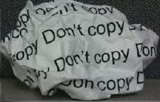 A picture of a crumpled up piece of paper with the words "Don't copy" written on it.